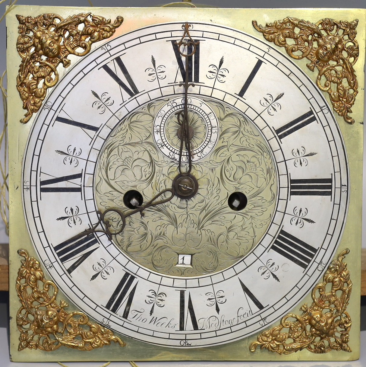 An 18th century brass eight day longcase clock movement, with silvered chapter ring, subsidiary seconds and date aperture marked Thomas Weeks, 28cm sq.